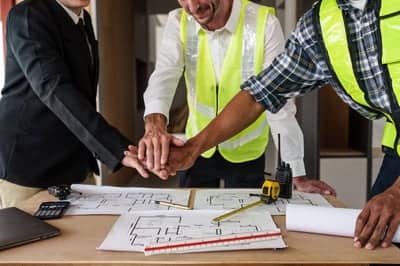 architecture-team-stacking-hands-working-together-2023-11-27-05-04-18-utc
